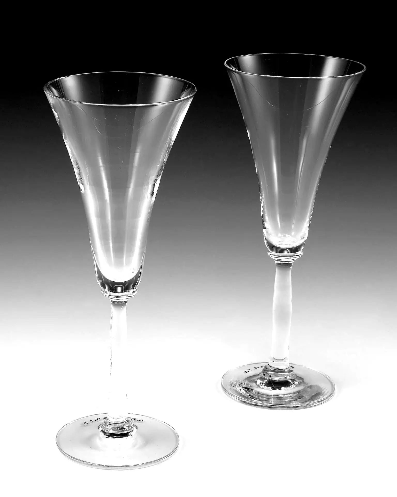 Black and white still life: two crystal champagne flutes side by side