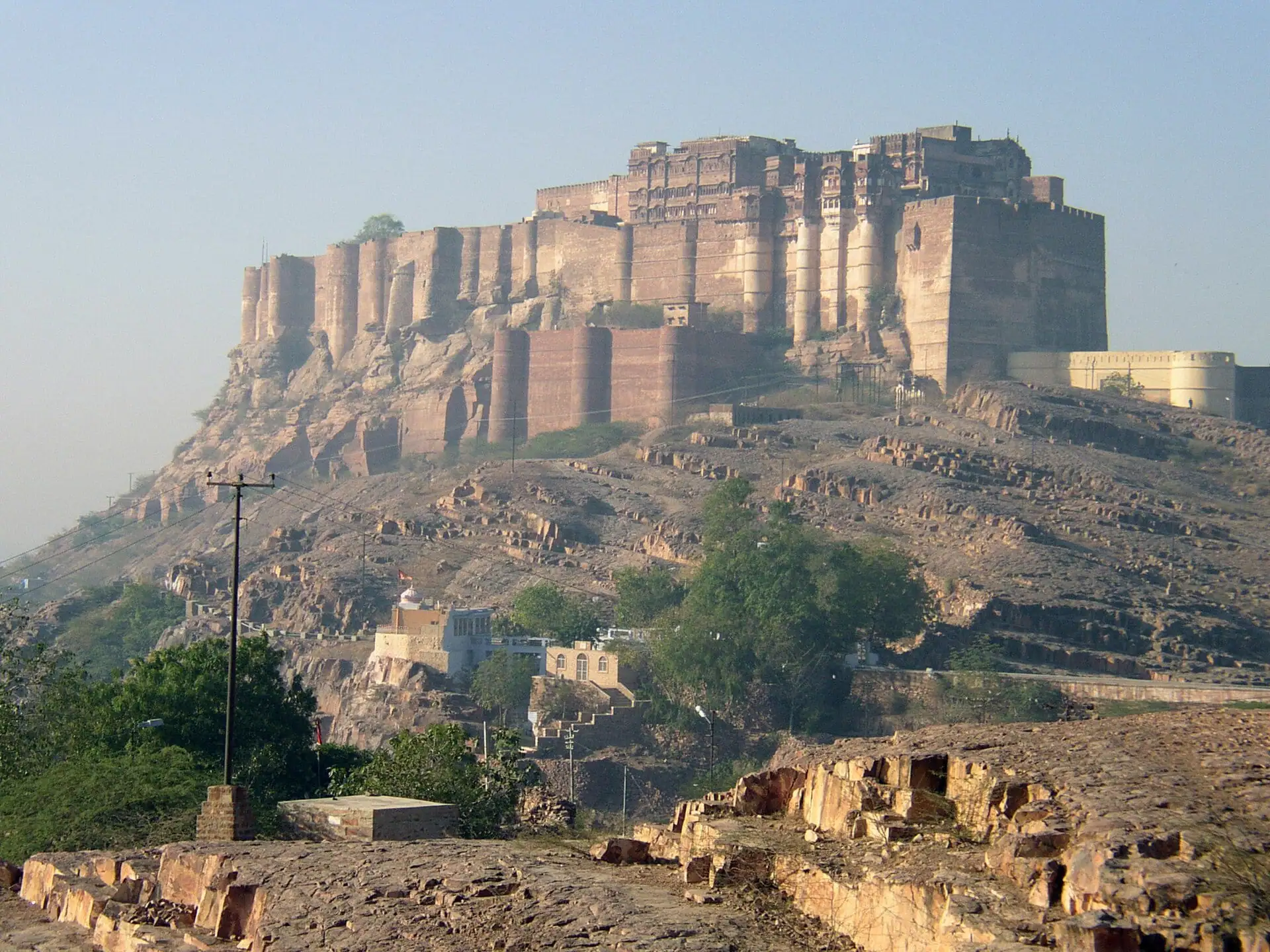 A sandstone fort along the crest of a rocky hill